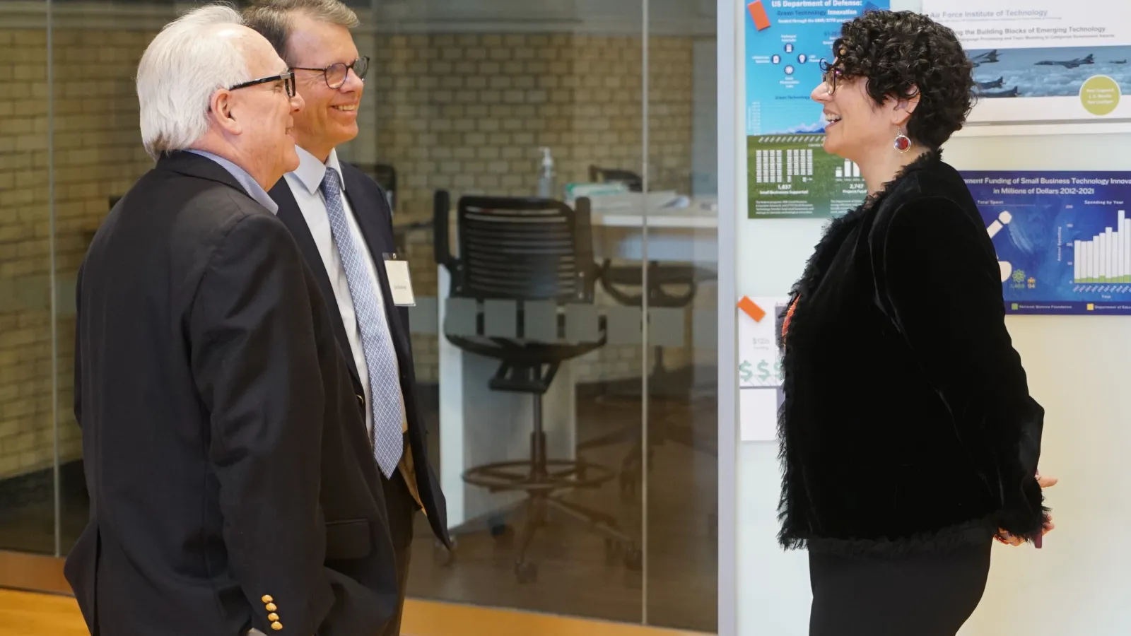 Graduation event guests chat with Dr. Tanya-Berger Wolf