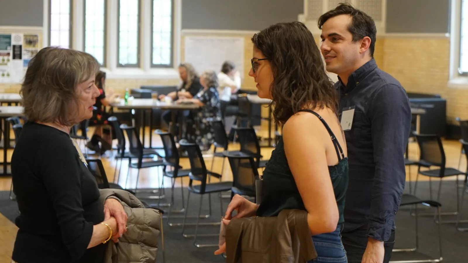Graduation even guests in conversation