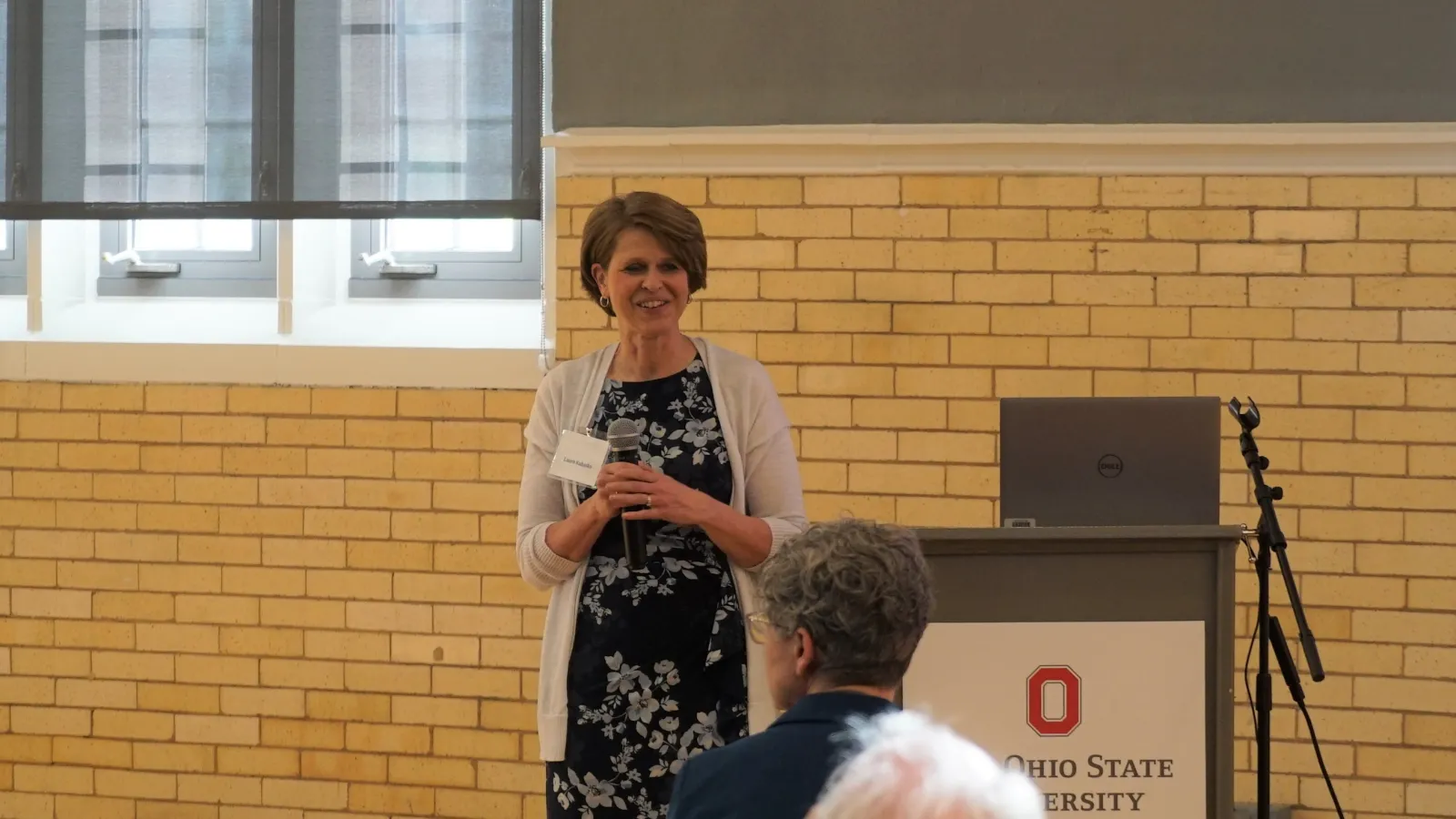 Dr. Laura Kubatko speaking at the 2023 Master of Translational Data Analytics graduation event 