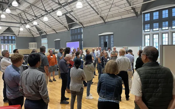 Scientists standing together in a workshop activity